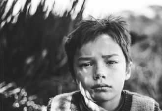 Black and white Photo of young boy